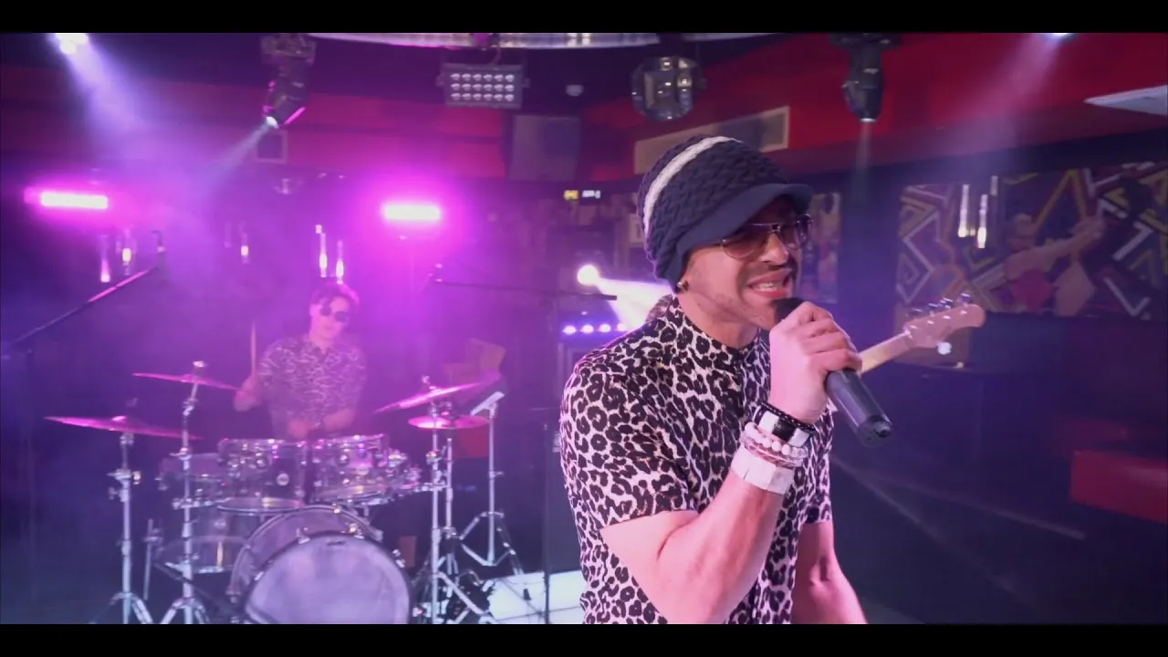 Lead vocalist singing into microphone during live show
